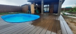 Укладка террасной доски из ДПК Good Cover Стандарт в зоне барбекю с бассейном