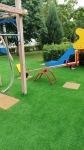 Монтаж искусственной травы на турбазе Волжино, на детской площадке